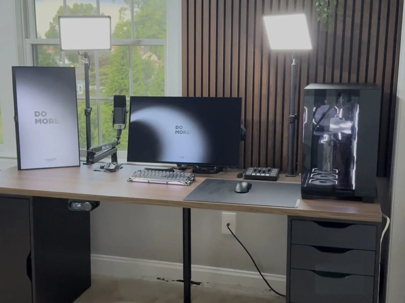 Luca's desk setup with a hand built PC, monitor, and streaming gear